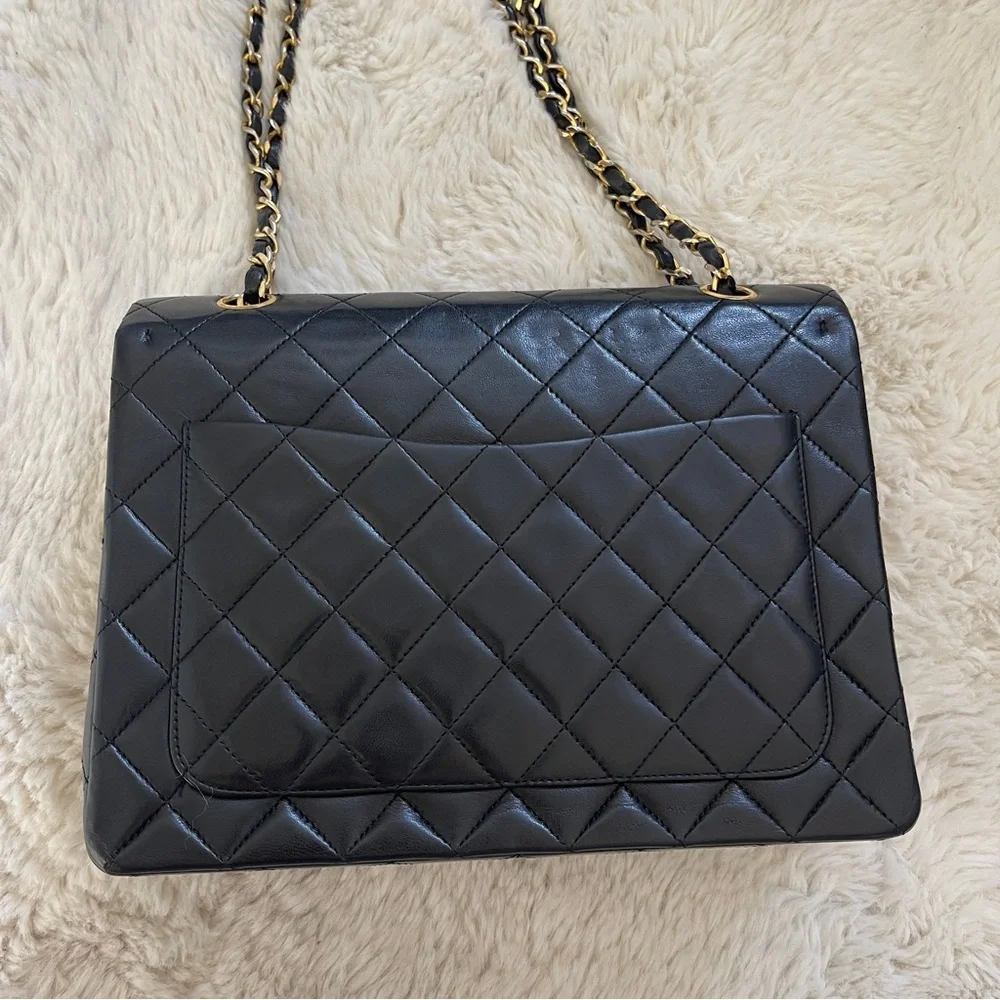 CHANEL Black Quilted Lambskin Classic Flap Bag with Gold Hardware